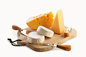 Brie, Parmesan and Emmental on wooden board