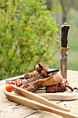 Grilled ribs and mushrooms on skewers