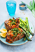 Sweet potato kumpir with green asparagus and wild garlic gremolata