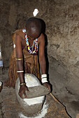 Datoga woman milling flour