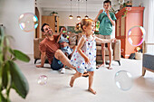 Father with children playing with bubbles