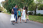 Parents with children walking on street