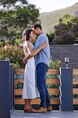 Couple embracing on terrace