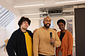 Portrait of smiling creative team having presentation in studio