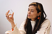 Woman holding glass cube