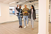 Coworkers talking in empty office