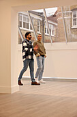 Workers walking in office, Two creative workers walking in modern empty office