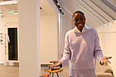 Smiling businesswoman dressed in casual clothes in office