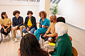 Employee holding microphone in team meeting