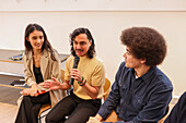 Employee holding microphone in team meeting