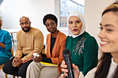 Employee holding microphone in meeting