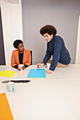 Employees working in office meeting room