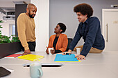 Employees working at desk in office