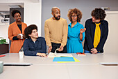 Employees working together at desk