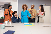 Employees working together at desk