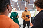 Employees having team meeting in office