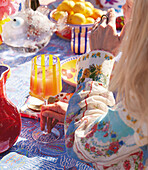 Woman drinking Bellini at a summer party