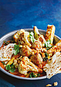 Butter cauliflower with paneer, coriander and naan bread