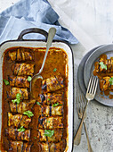 Oven-baked aubergine rolls with coconut curry paste
