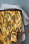 Vegan focaccia with green asparagus and vegan cheese cream