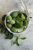 Bowl of feijoa fruit and leaves