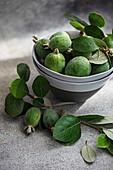 Bowl with feijoa fruit and leaves