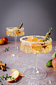 Non-alcoholic apple and cinnamon cocktail with thyme and cinnamon