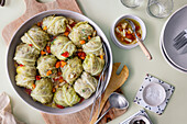 Cabbage rolls in vegetable stock made from celery, tomatoes and carrots