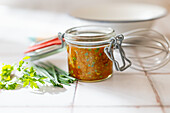 Basic salad dressing with olive oil, apple cider vinegar, herbs and paprika