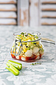 Couscous salad with peppers, courgette, celery and mozzarella