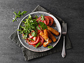 Crispy caprese with rocket and tomato salad