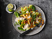 Roasted corn salad with tortilla chips and Caesar salad dressing