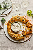 Börek with sesame seeds and yoghurt dip