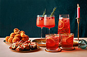 Carbonara arancini, figs stuffed with ham, Aperol Spritz and Campari soda