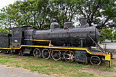 An old steam locomotive engine on display in the Paseo Estacion Park in San Jose de Metan, Argentina.