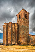 The Gothic church of Nuestra Señora del Rosario stands proudly in the hamlet of Gallinero, surrounded by dramatic skies and scenic landscapes.