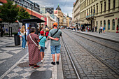 People waiting for the tram in Prague