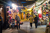 Rabat, Morocco, Apr 24 2015, Shoppers explore colorful stalls in the Medina of Rabat, enjoying local crafts and the lively atmosphere as evening sets in.