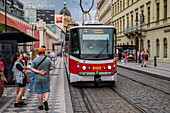 People waiting for the tram in Prague