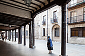 Burgo de Osma, Spain, Aug 12 2009, A serene afternoon stroll along Calle Mayor in El Burgo de Osma, featuring historic architecture and charming arcades.