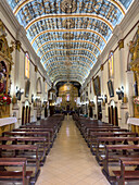 The nave and painted tunnel vault ceiling of the Cathedral of San Salvador de Jujuy, Argentina.