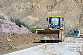 A front-end loader clears debris off National Route 52 after a mudslide between Purmamarca & Salinas Grande, Argentina.