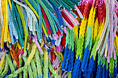 Colorful paper cranes or origami hanging from a cenotaph as an offering at the Hiroshima Peace Memorial Park