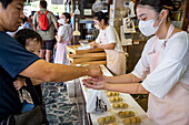 Selling the traditional Daifuku in Nakatanidou shop, made of soft rice cake (mochi) fill with sweet bean paste, in Nara Japan.