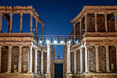 Merida, Spain, Aug 15 2024, Majestic night view of the ancient Roman Theater in Merida, Spain, beautifully illuminated and prepared for an evening performance under the starry sky.