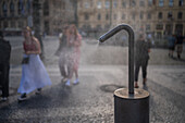 Refreshing water spray fountain to alleviate the high temperatures in summer, Prague