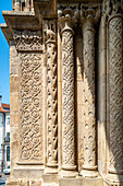 Close up of the detailed Romanesque architecture on Se Velha in Coimbra, Portugal.