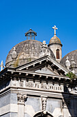 A cross on an elaborate tomb or mausoleum in the Recoleta Cemetery, Buenos Aires, Argentina.