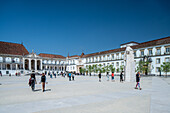 Coimbra, Portugal, Apr 13 2017, People walking in the University of Coimbra courtyard under clear skies.