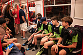 Young sports team traveling in Prague Metro wagon